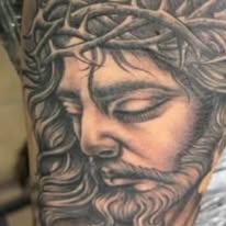 Black and grey crown of thorns and cross tattoo, by E